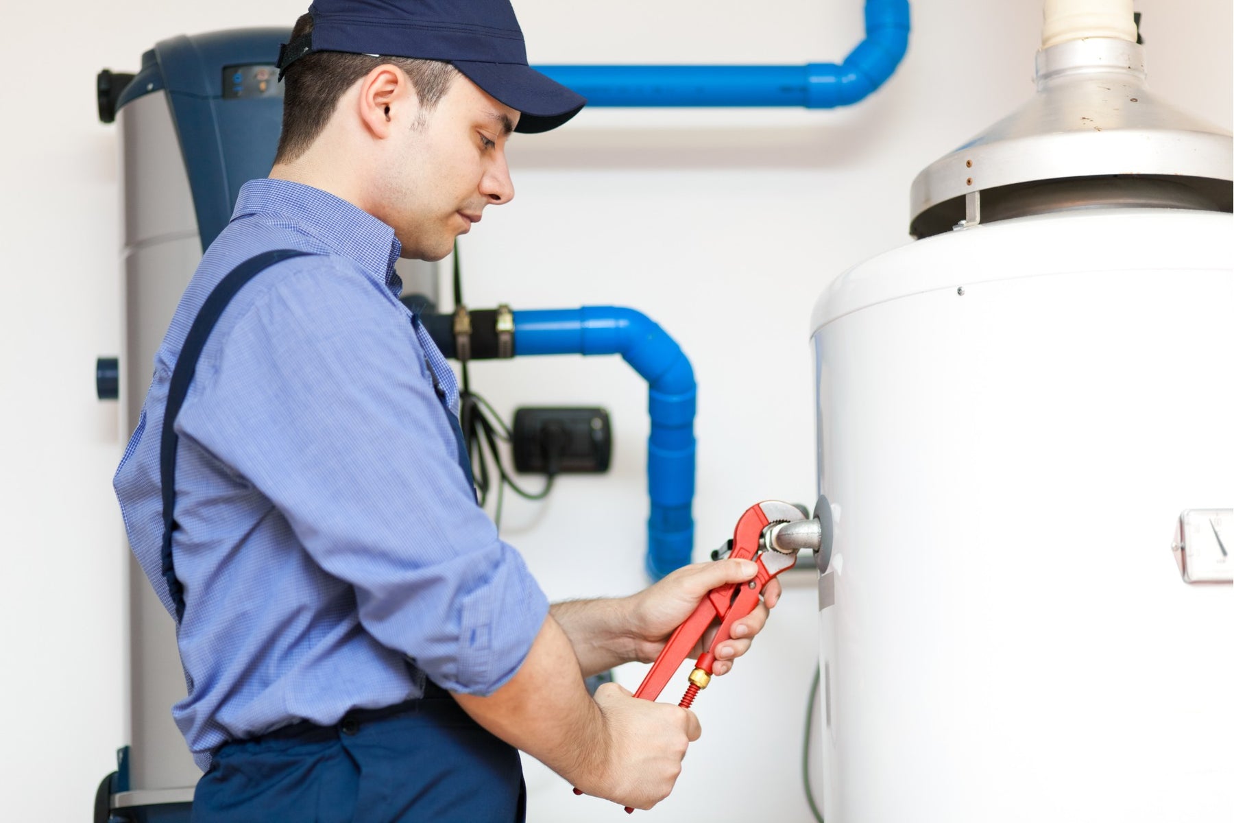 Plumber installing a brand new water heater