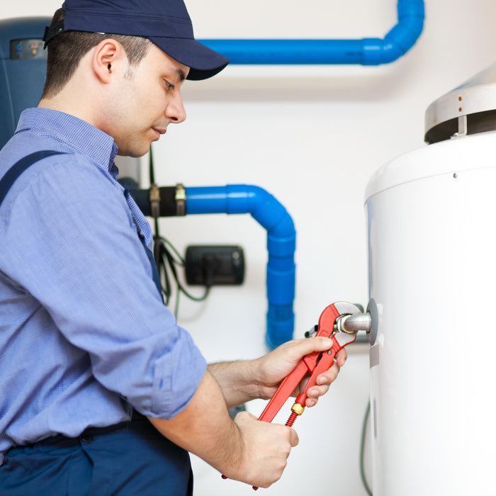 Plumber installing a brand new water heater